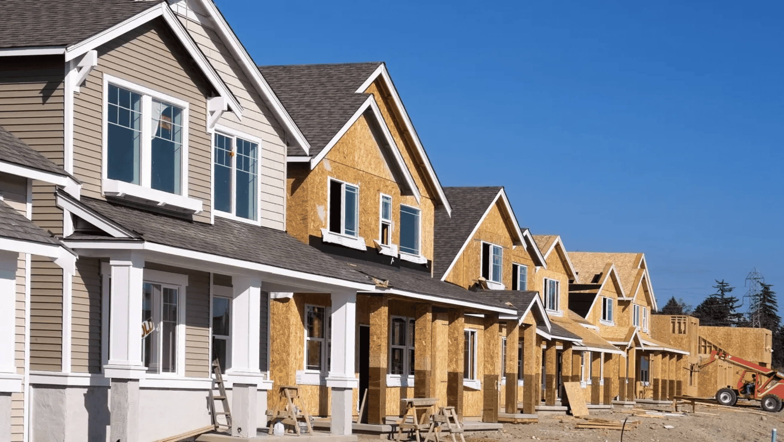 A row of houses in mid-construction.