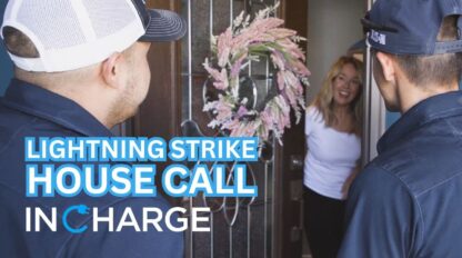 In Charge employees helping a person with a lightning strike at their home.