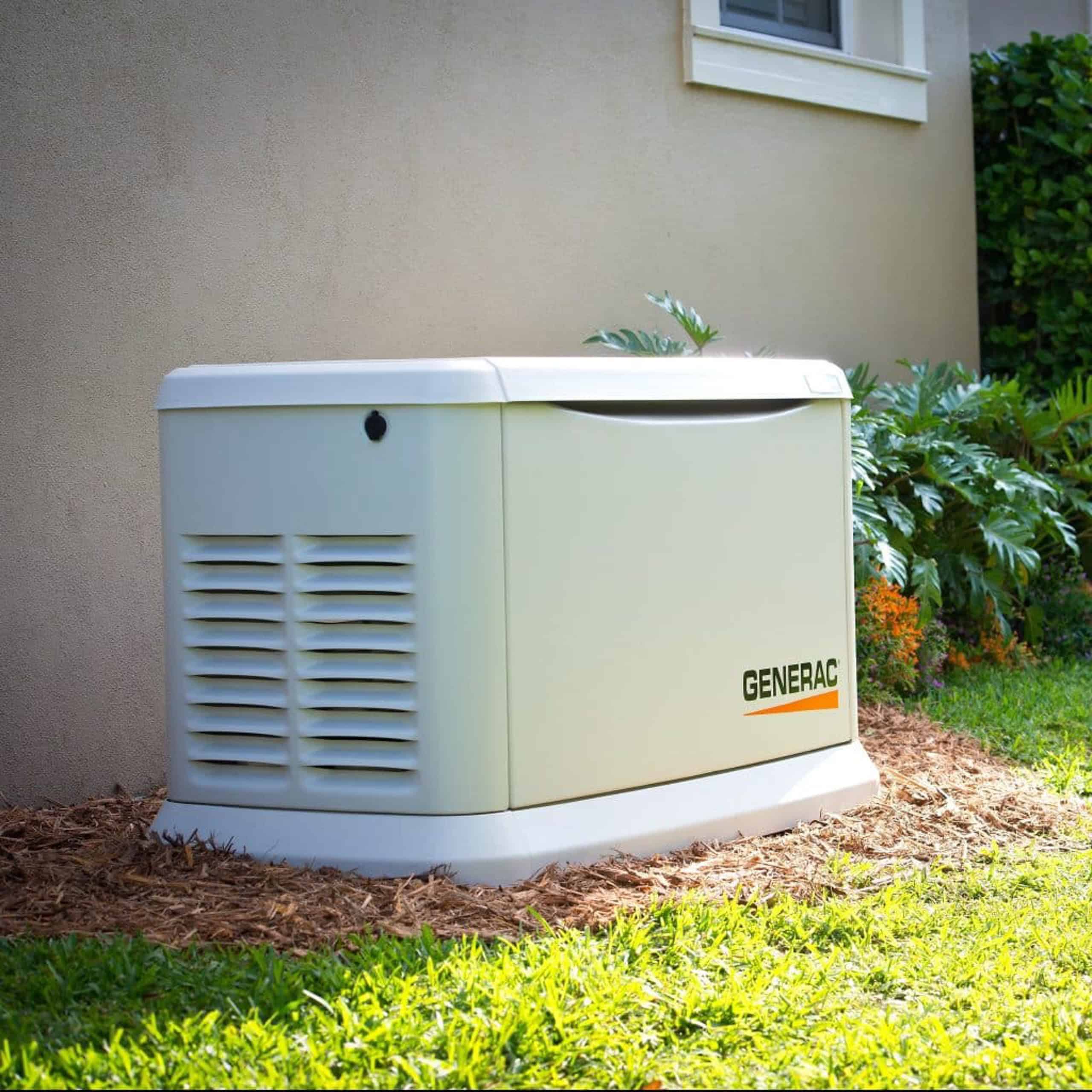 A Generac standby generator is installed next to a house|||